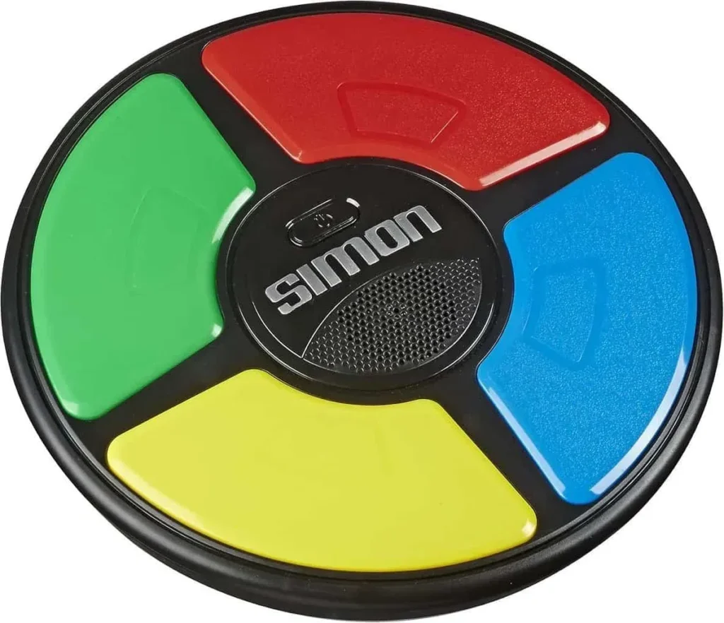 Hasbro Gaming Simon Handheld Electronic Memory Game With Lights and Sounds for Kids Ages 8 and Up, Includes Simon game unit and instructions.